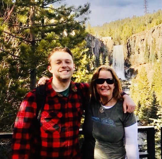 Kiefer and his mom in front of a waterfall