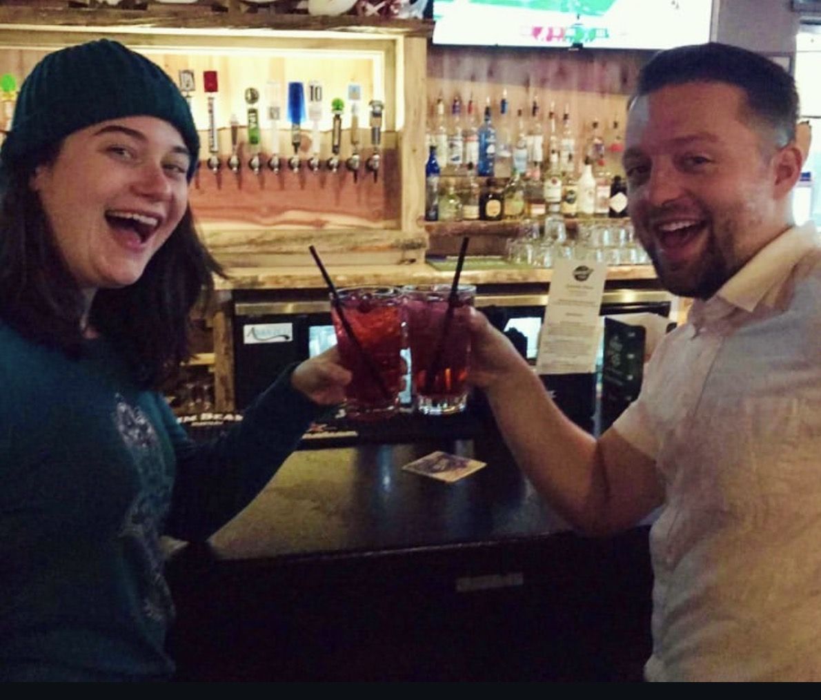 Kiefer raising a glass with a friend