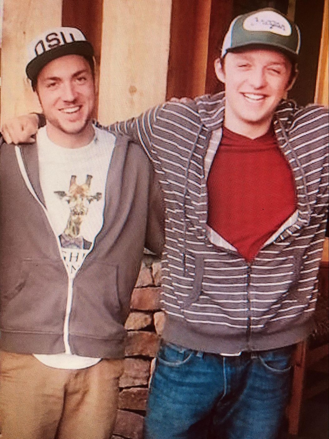 Kiefer with a friend, arms around each other